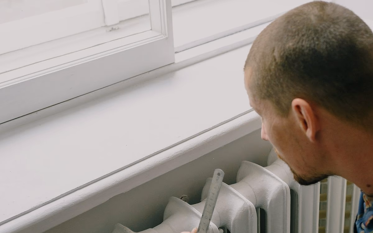 Retrofit surveyor assessing a British home